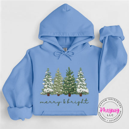 Close up of evergreen trees and script on a Carolina Blue pullover hoodie.