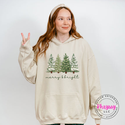Sand pullover hoodie featuring classic Christmas trees and merry and bright script.