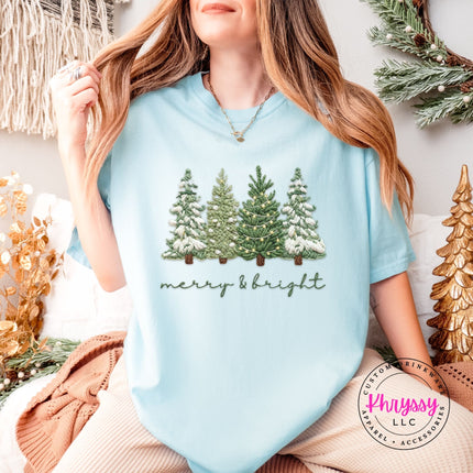 Chambray Comfort Colors tee styled with jeans, showing the full Christmas trees graphic.