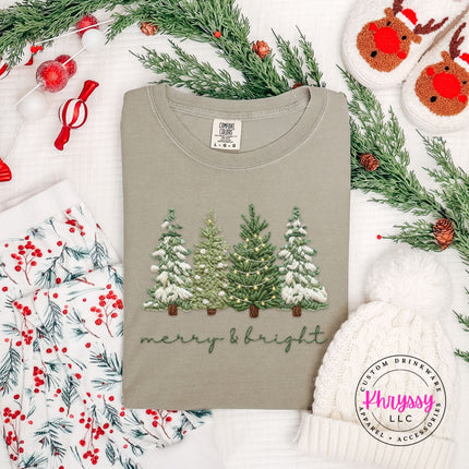 Relaxed Khaki Comfort Colors tee with an embroidery style Christmas trees graphic.
