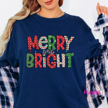 Flat lay of the Merry and Bright patterned Christmas tee in True Navy.
