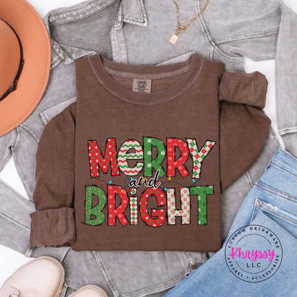 Espresso long sleeve tee showing candy stripe and polka dot holiday letters.