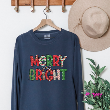 Model wearing the Merry and Bright patterned long sleeve tee in Midnight.