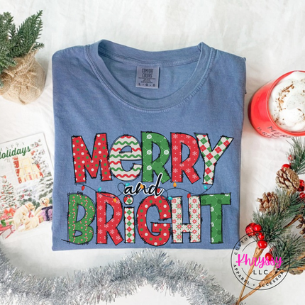 Model wearing the Merry and Bright patterned tee in Blue Jean.