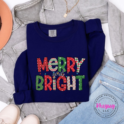 Flat lay of the Merry and Bright patterned Christmas long sleeve tee in True Navy.