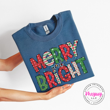 Indigo Blue crewneck sweatshirt featuring patterned Merry and Bright block letters.