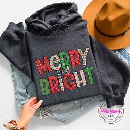 Dark Heather hoodie showing candy stripe and polka dot holiday letters.