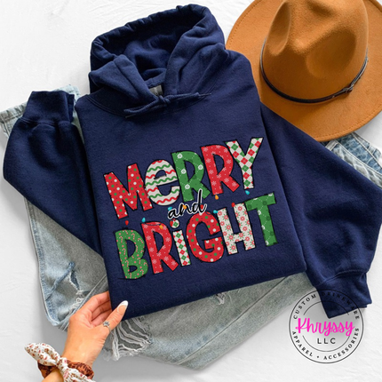 Model wearing the Merry and Bright patterned hoodie in Navy.