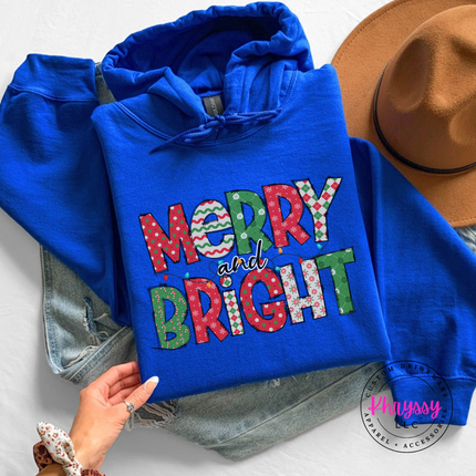 Close up of the Merry and Bright patterned art on a Royal hoodie.