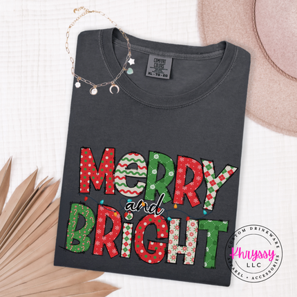 Graphite tee featuring patterned Merry and Bright block letters.