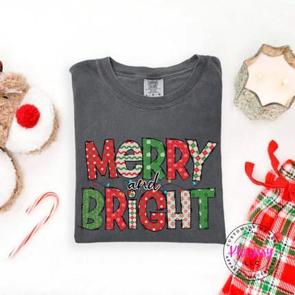Pepper tee showing candy stripe and polka dot holiday letters.