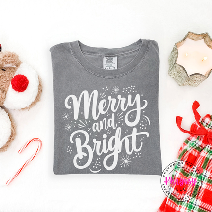 Gray tee showing Merry and Bright script with tiny sparkles.