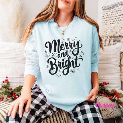 Chambray long sleeve tee showing Merry and Bright script with tiny sparkles.