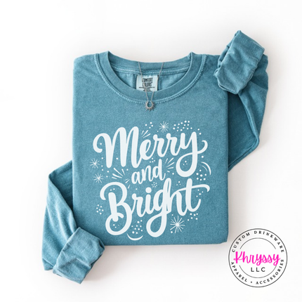 Ice Blue long sleeve tee featuring flowing Merry and Bright script lettering.