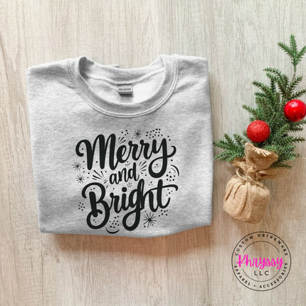 Ash crewneck sweatshirt featuring flowing Merry and Bright script lettering.