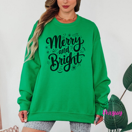 Irish Green crewneck sweatshirt showing Merry and Bright script with tiny sparkles.