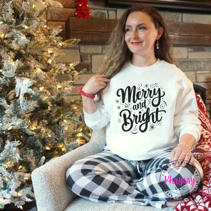 Flat lay of the Merry and Bright Christmas crewneck sweatshirt in White.