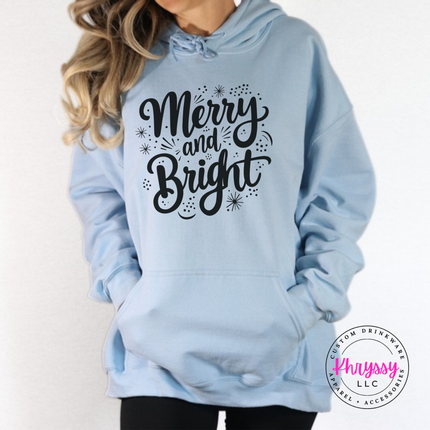 Light Blue hoodie showing Merry and Bright script with tiny sparkles.