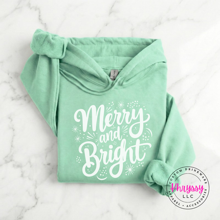 Mint Green hoodie featuring flowing Merry and Bright script lettering.