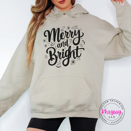Close up of the Merry and Bright art on a Sand hoodie.
