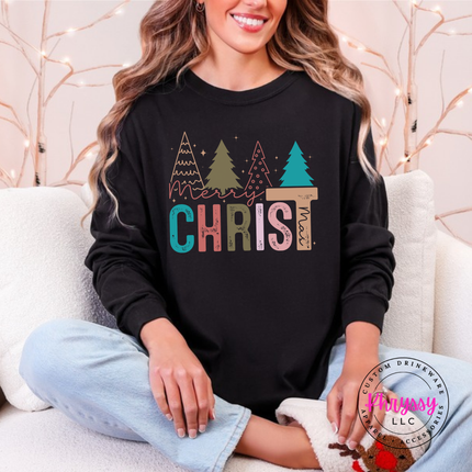 Black long sleeve tee featuring Merry Christ mas lettering and colorful trees.