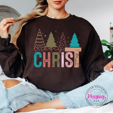 Close up of the Merry Christ mas art on a Dark Chocolate crewneck sweatshirt.