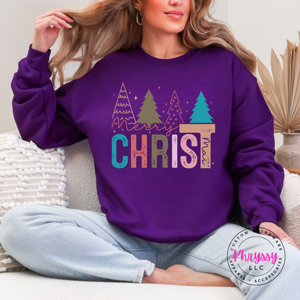 Close up of the Merry Christ mas art on a Purple crewneck sweatshirt.