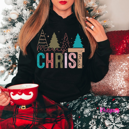 Black hoodie featuring Merry Christ mas lettering and colorful trees.