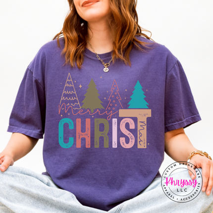 Flat lay of the Merry Christ mas Christmas tee in Grape.