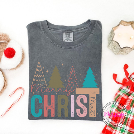 Pepper tee showing bold CHRIST letters under four Christmas trees.