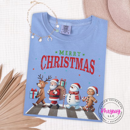 Washed Denim long sleeve tee showing a reindeer, Santa, a snowman, and gingerbread.