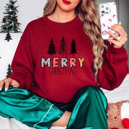 Cardinal Red crewneck sweatshirt featuring sketched pine trees and Merry Christmas lettering.
