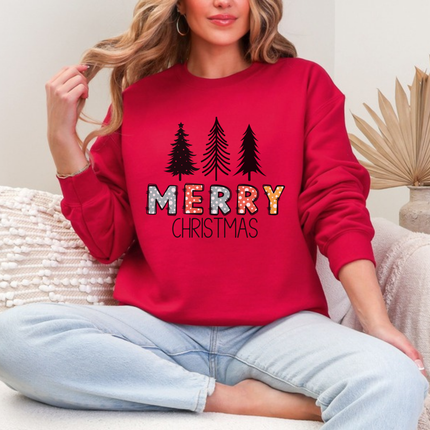 Close up of the Merry Christmas pine art on a Cherry Red crewneck sweatshirt.