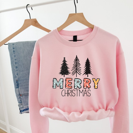 Light Pink crewneck sweatshirt featuring sketched pine trees and Merry Christmas lettering.