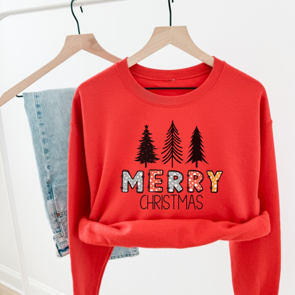 Model wearing the Merry Christmas pine crewneck sweatshirt in Red.