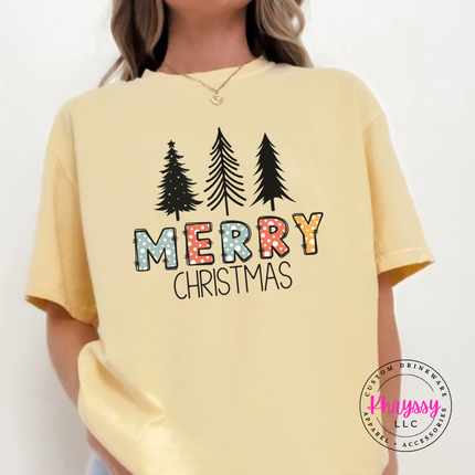 Model wearing the Merry Christmas pine tee in Butter.