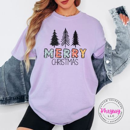 Close up of the Merry Christmas pine art on an Orchid tee.