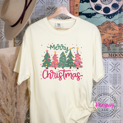 Banana tee featuring pink and green trees with Merry Christmas script.