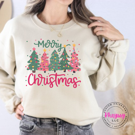 Model wearing the Merry Christmas tree crewneck sweatshirt in Sand.