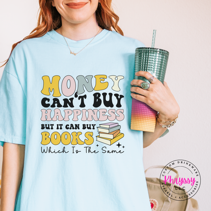 Person wearing a light blue t-shirt with a motivational quote, holding a colorful drink cup.