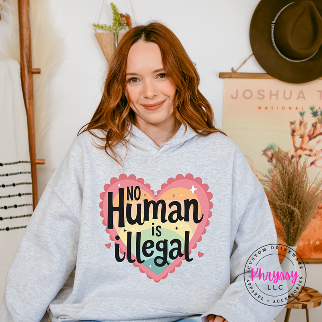 Heavyweight activism pullover with bold heart no human is illegal graphic