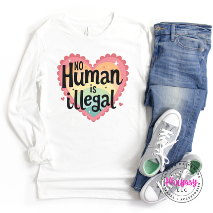 White sweatshirt with 'No Human is Illegal' design, blue jeans, and white sneakers on a white background.