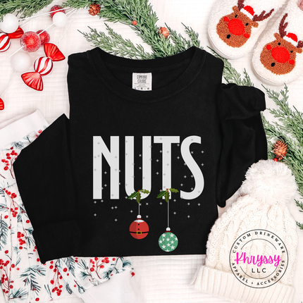 Black long sleeve tee with bold Nuts lettering and two hanging ornaments.