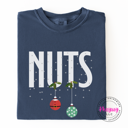 Man wearing the Nuts Christmas ornament long sleeve tee in Denim.
