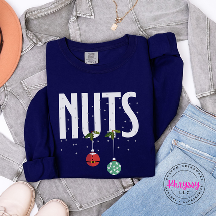 True Navy long sleeve tee featuring holly, snowflakes and two holiday ornaments.
