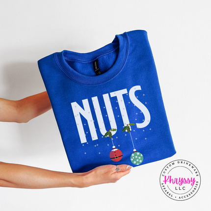 Royal crewneck sweatshirt featuring holly, snowflakes and two holiday ornaments.