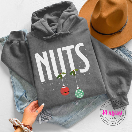 Man wearing the Nuts Christmas ornament hoodie in Charcoal.