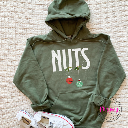 Military Green hoodie with bold Nuts lettering and two hanging ornaments.
