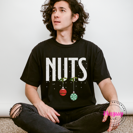 Black tee with bold Nuts lettering and two hanging ornaments.