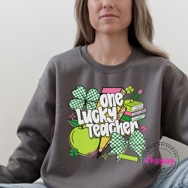 Charcoal crewneck sweatshirt with a colorful one lucky teacher shamrock print.